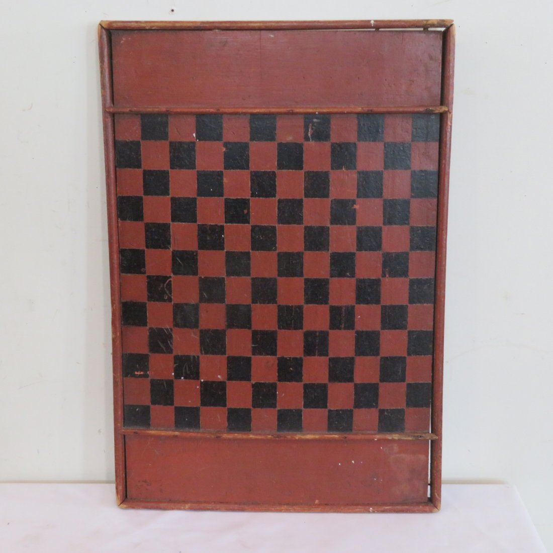 Late 19th century wood painted game board: Late 19th century wood painted game board, red and black, single pine board with moldings around edges, square nail construction, 25.5" x 17.5"