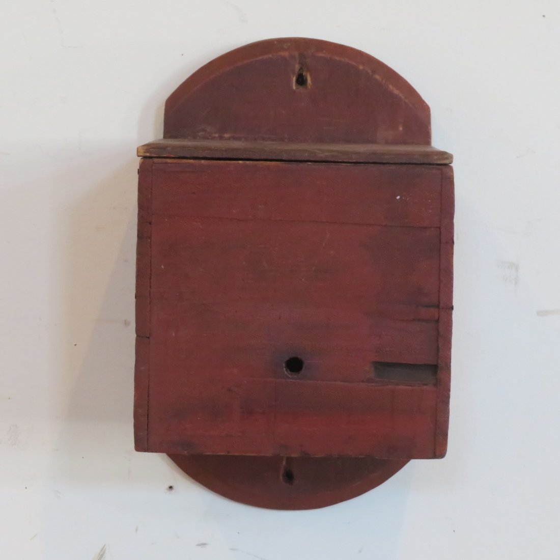 Old wall mount wood string or twine holder: Early 20th century wall mounted wood string or twine holder with lid and old red painted surface. May be an old country general store item, 14" x 8.5" x 9"