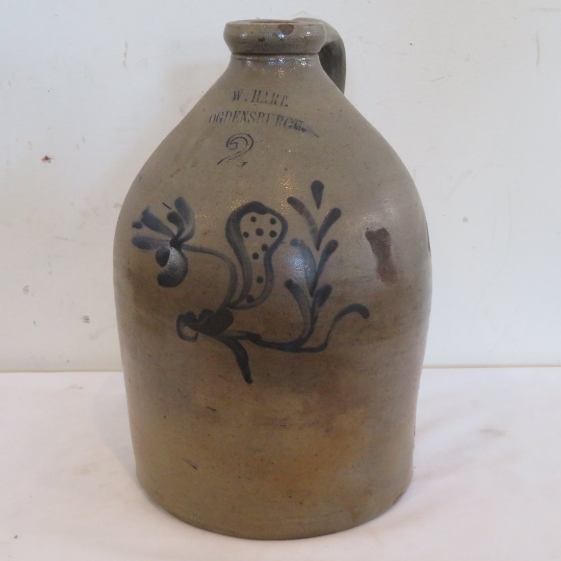 2 gal. NY stoneware decorated jug: 2 gal. stoneware jug with unusual blue decoration signed W. Hart, Ogdensburgh, 13" t. x 8"