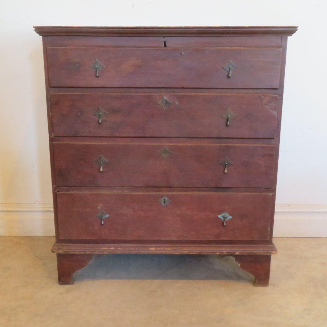 18th century New England 2 drawer blanket chest: 18th century pine New England blanket chest with 2 functional dovetailed drawer and 2 faux drawers, cotter pin hinges, 2 board back, old dark natural patina surface, replaced Wm & Mary brasses, 43" t.