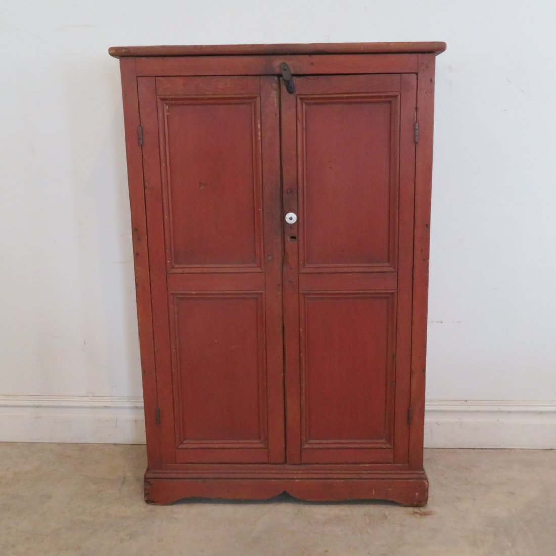 Pine jelly cupboard in old red paint: Pine 2 double panel doors jelly cupboard in old red paint with bracket base, hand chamfered doors, square nail construction, 54" x 36" x 14"