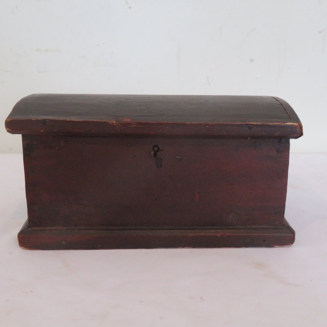Early dome top document box in old red paint: Early dome top document box in old red paint, square nail construction, brass butt hinges, 4.75" x 8.75" x 5"