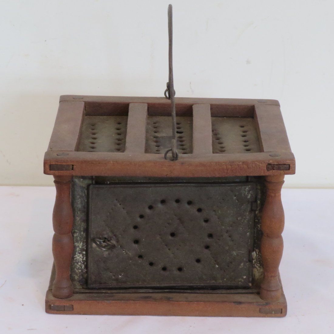 Punched tin and wood foot warmer: Punched tin and wood foot warmer, old natural patina, wire bale handle, mortise and tenon construction, 6" x 8.5" x 7.75"