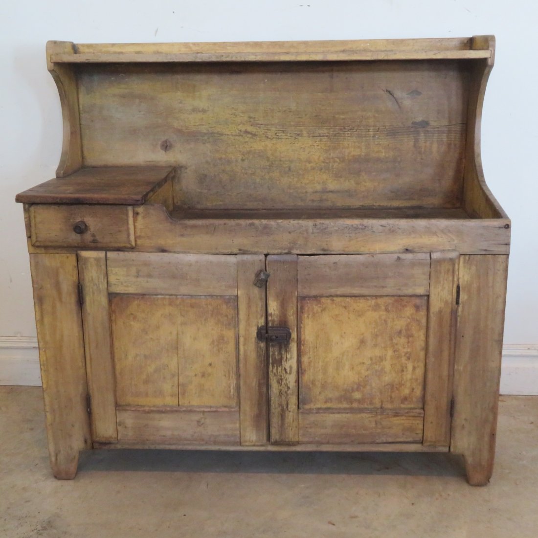 Early high back pine dry sink in old mustard paint: Early high back pine dry sink in old mustard paint, dovetail drawer, doors are chamfered overlapping, square nail construction. 45.5 t. x 48" w. x 19.5 deep