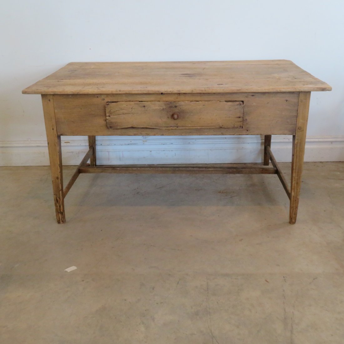 Pine T stretcher base work table with drawer: Pine T stretcher base work table with nailed drawer, legs all wood pinned, stretcher is mortised through, natural wood surface, square nails secure the top, 27" x 54" x 33.5"