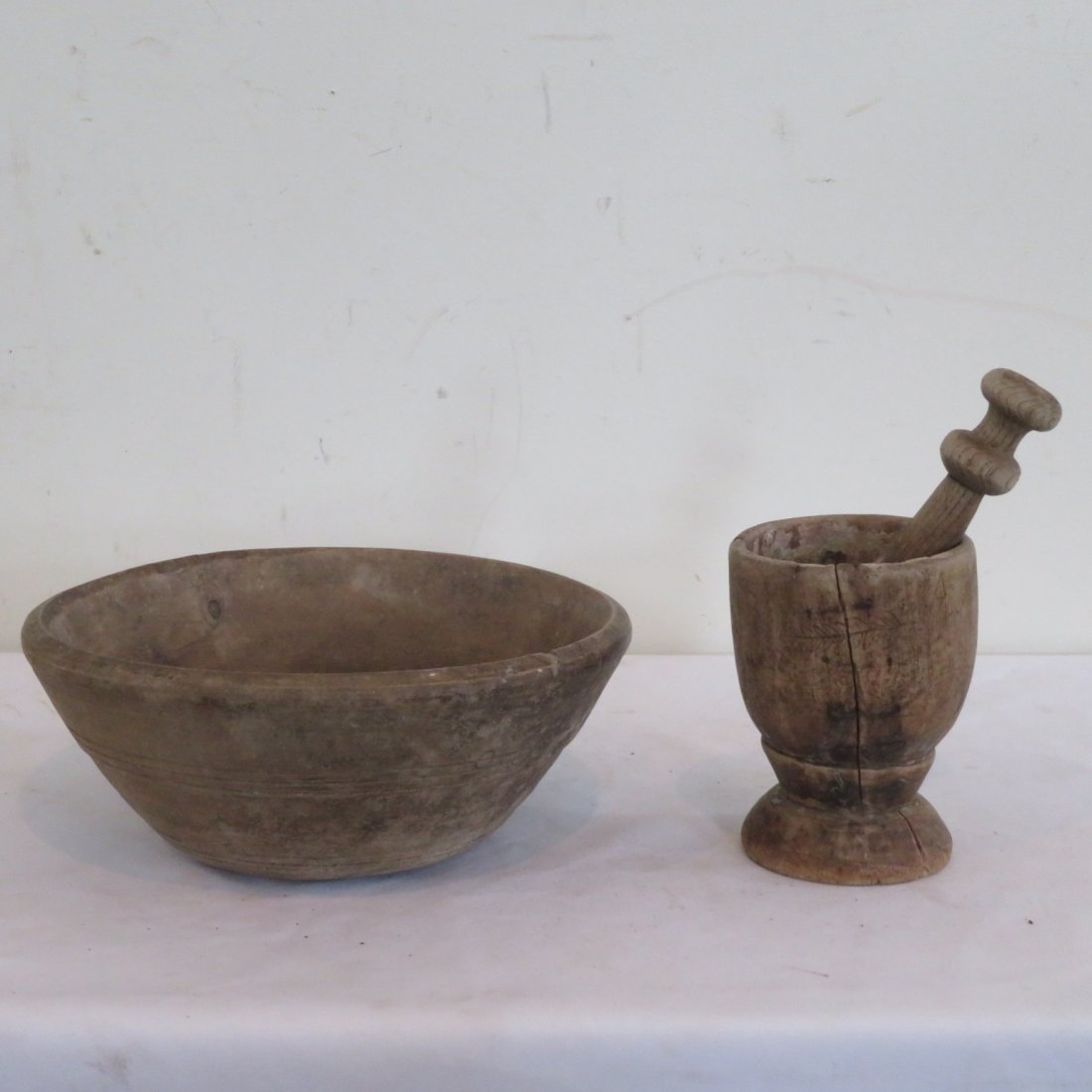 Treenware bowl and mortar & pestle: Treenware bowl and mortar & pestle, old natural patina, bowl is 4"H x 9.5"W, Mortar is 5.25"H x 3.75"W, mortar has carvings, nice set