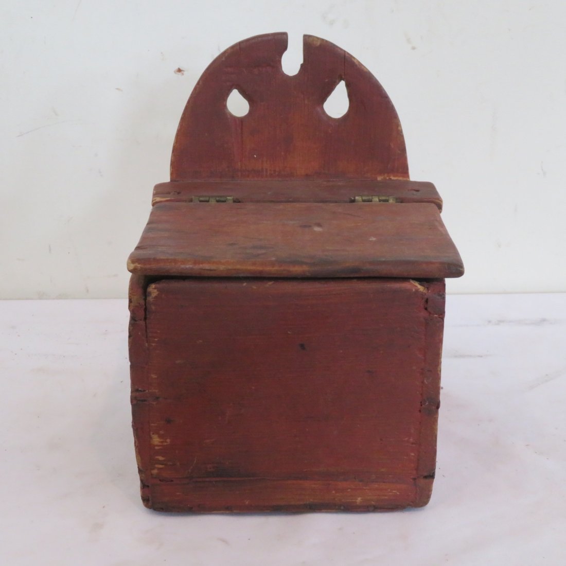 Hanging salt box in old red paint: Hanging salt box in old red paint, both square and round head nail construction