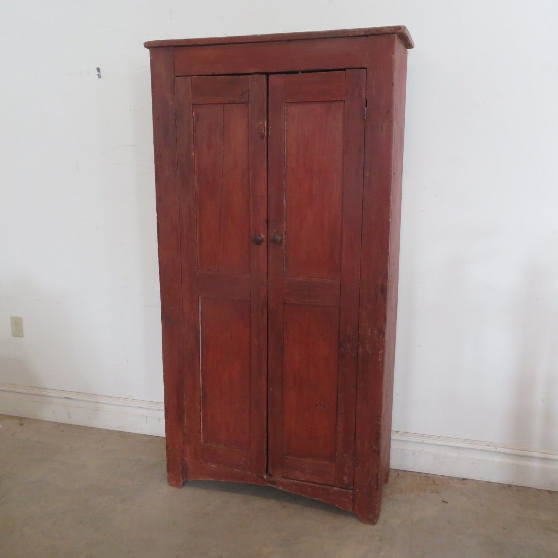 Early pine flat wall cupboard in old red paint: Early pine flat wall cupboard in old red paint, doors are mortise and tenon construction, 72" x 36" x 14