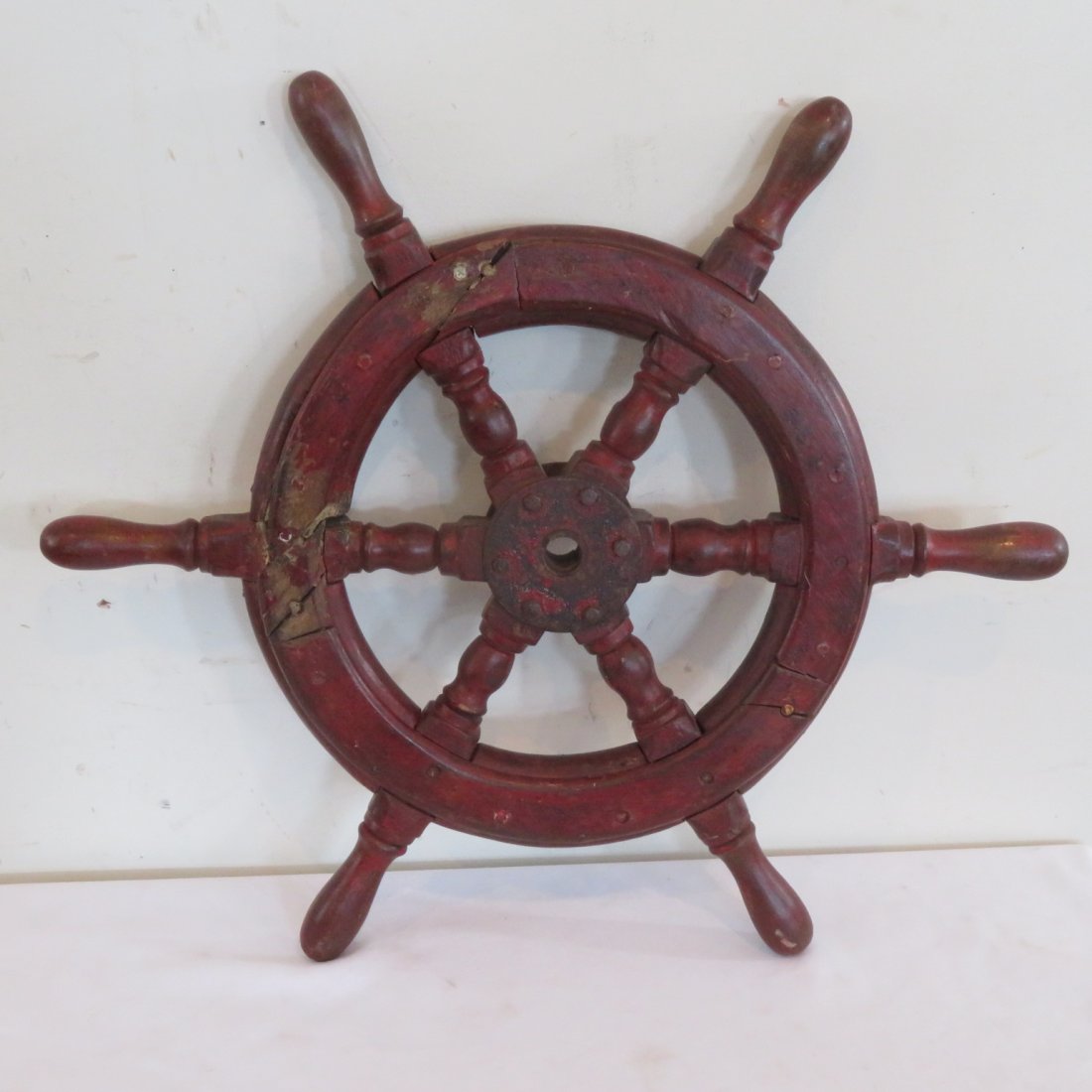Nautical ship's steering wheel: Nautical ship's steering wheel in red paint, 24" x 2"