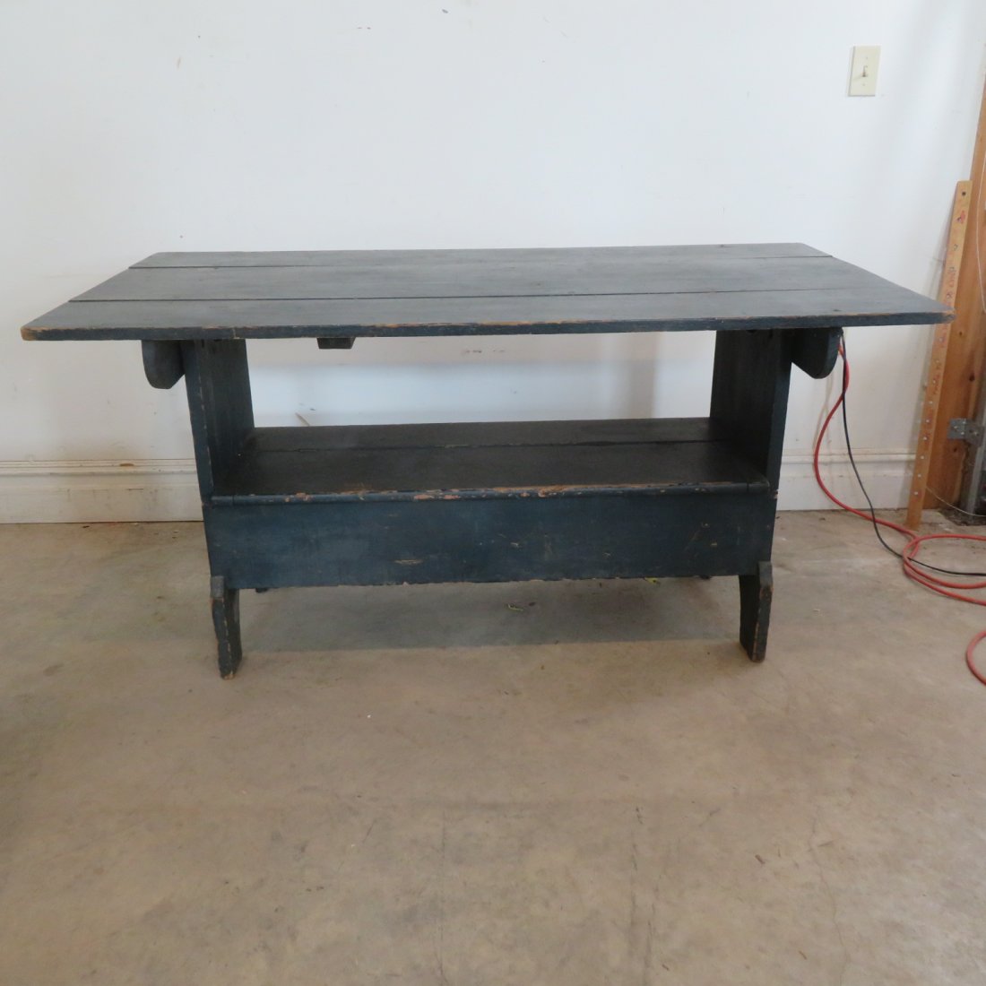 Pine hutch table in old dark blue/green paint: Pine hutch table in old dark blue/green paint, with lift-up storage area in base, square nail construction, 29" x 60" x 30"