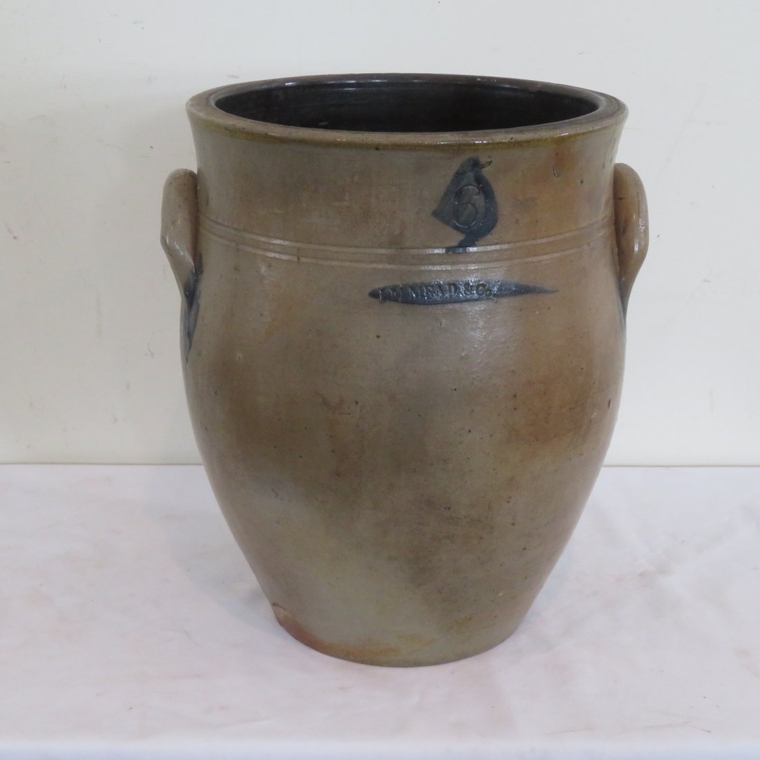 6 gal. ovoid stoneware jar signed I.M. Mead: 6 gal. ovoid stoneware jar signed I.M. Mead (Mogadore, OH) with blue design, 15" x 12"