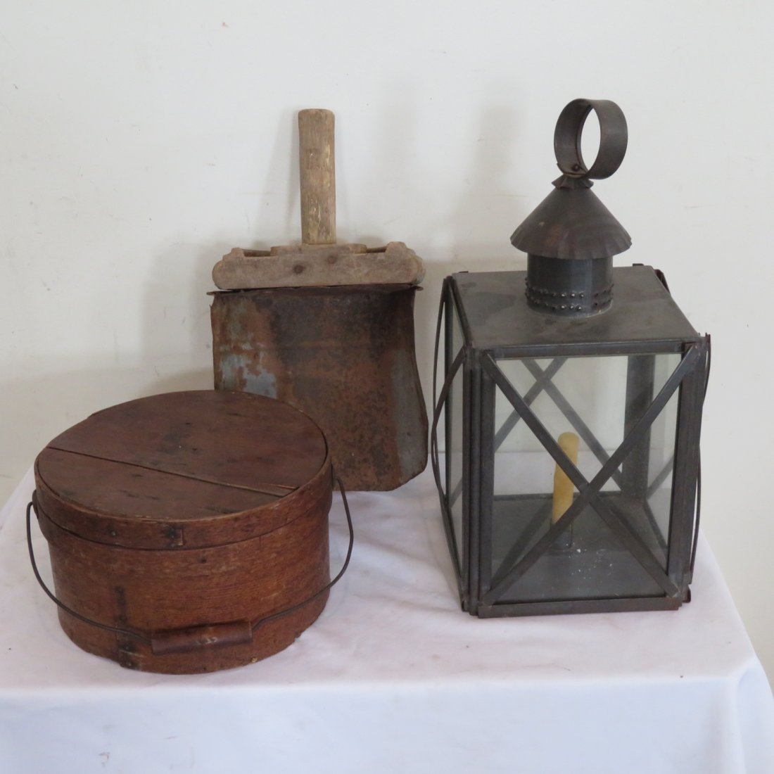 Pantry box with wire bail, newer lantern, scoop: 11" dia. and 6"H pantry box with wire bail & wood handle in natural old surface, contemporary tin candle lantern 19" t. to top of handle and a large old tin scoop with wood handle