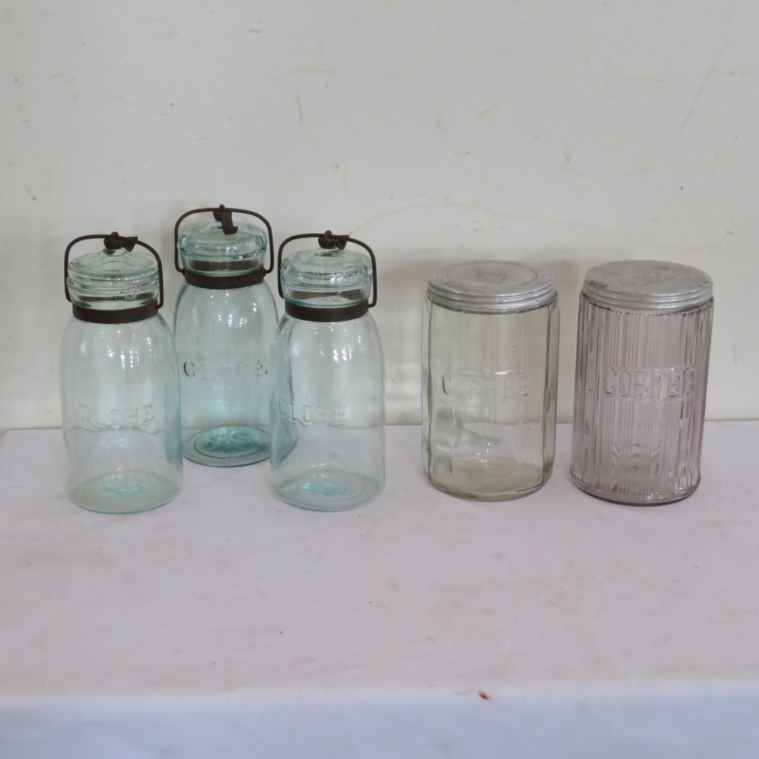 3 Globe aqua fruit jars, 2 "Coffee" canisters with lids: 3 aqua Globe fruit jars with lids and 2 "Coffee" kitchen cabinet canisters with tin lids, coffee canisters are 7"H, fruit jars 8 1/2"H