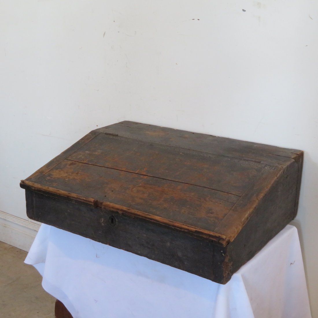 Early counter desk: Early pine counter desk in worn old dark green paint, 3 interior dovetail drawers, bread board end slant lid, 10" x 30.5" x 24"