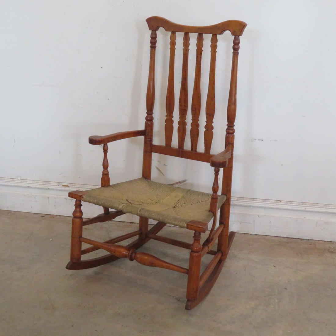 18th century bannister back maple rocker: 18th century maple bannister back rocker made for full lady\'s dresses, wood pinned, rush seat, refinished, 39" x 23" x 17"