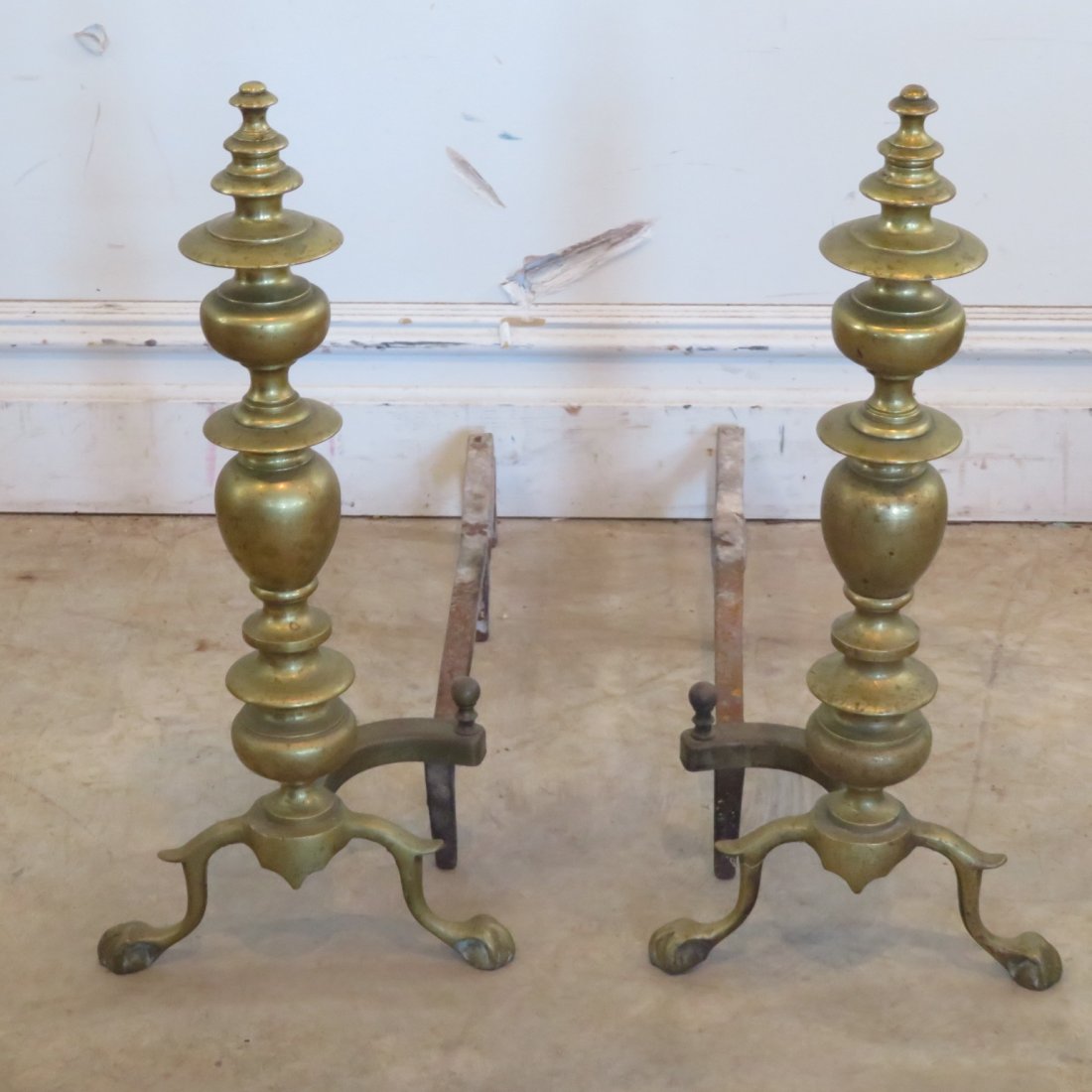 Pair of brass andirons with claw feet: Pair of brass andirons with claw feet, may be centennial, old finish, 22"H x 9.5"W, 26"Deep
