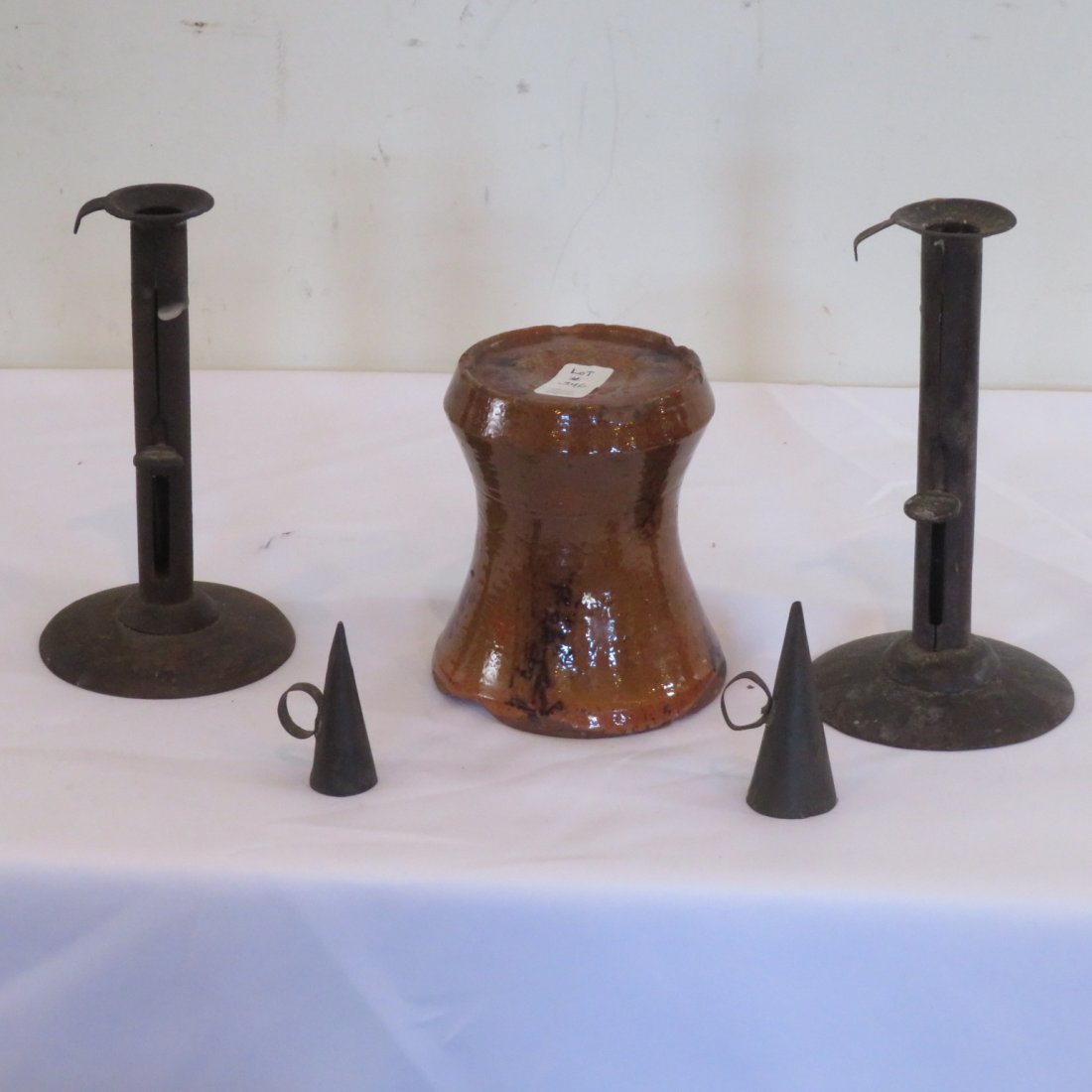 Group of lighting and redware betty lamp stand: Group of lighting, redware betty lamp stand is 5"H x 4"D with manganese glaze, 2 hog scraper candle sticks with push ups and hangers tallest is 7.5"H, 2 tin snuffers