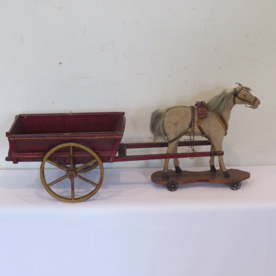 Burlap covered horse on wheels pulling a cart (1 of 7)