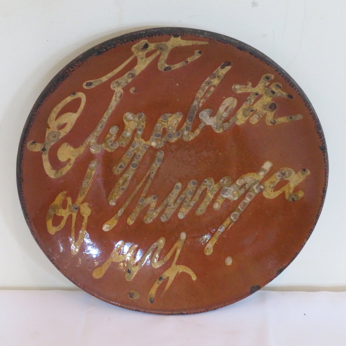 Early redware plate with slip decoration (1 of 2)
