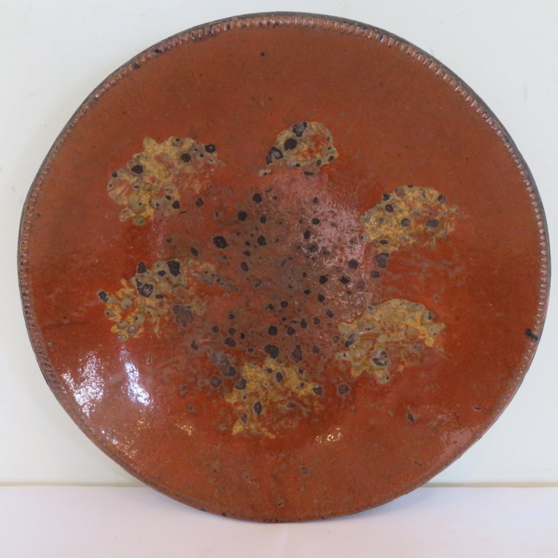 Early Pa. redware plate with slip decoration (1 of 4)