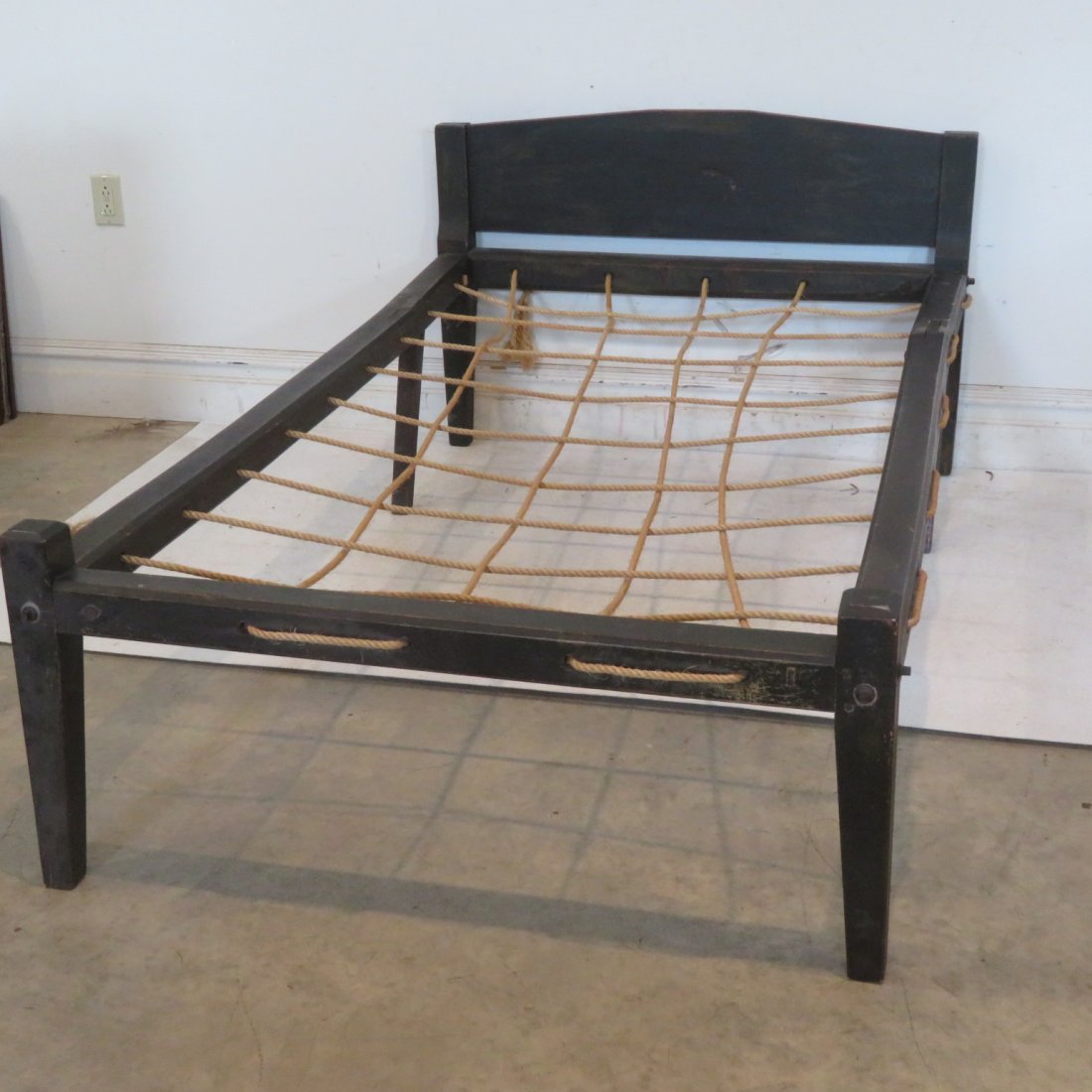 New England rope press bed in old green paint: New England rope press bed in old green paint, includes feather tick, twin size, complete with bolts, 30"H x 43"W x rails are 69"L