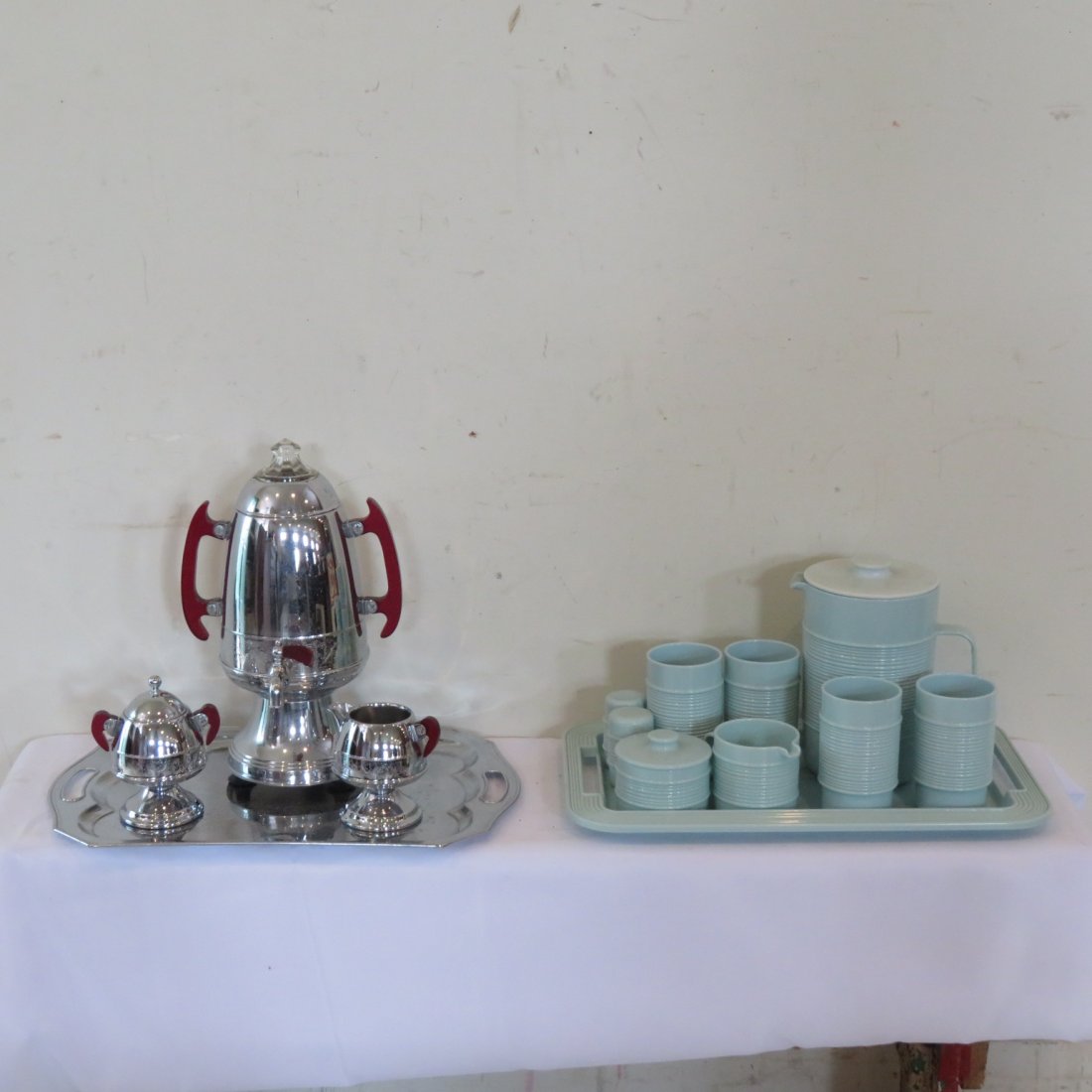 Mid Century coffee and lemonade sets: Mid-century coffee urn with cream, sugar and tray, bakelite handles, urn 14" t., tray 12" x 18" and also plastic Rubbermaid lemonade pitcher, 4 tumblers, cream, sugar, salt & peppers and tray, pitcher