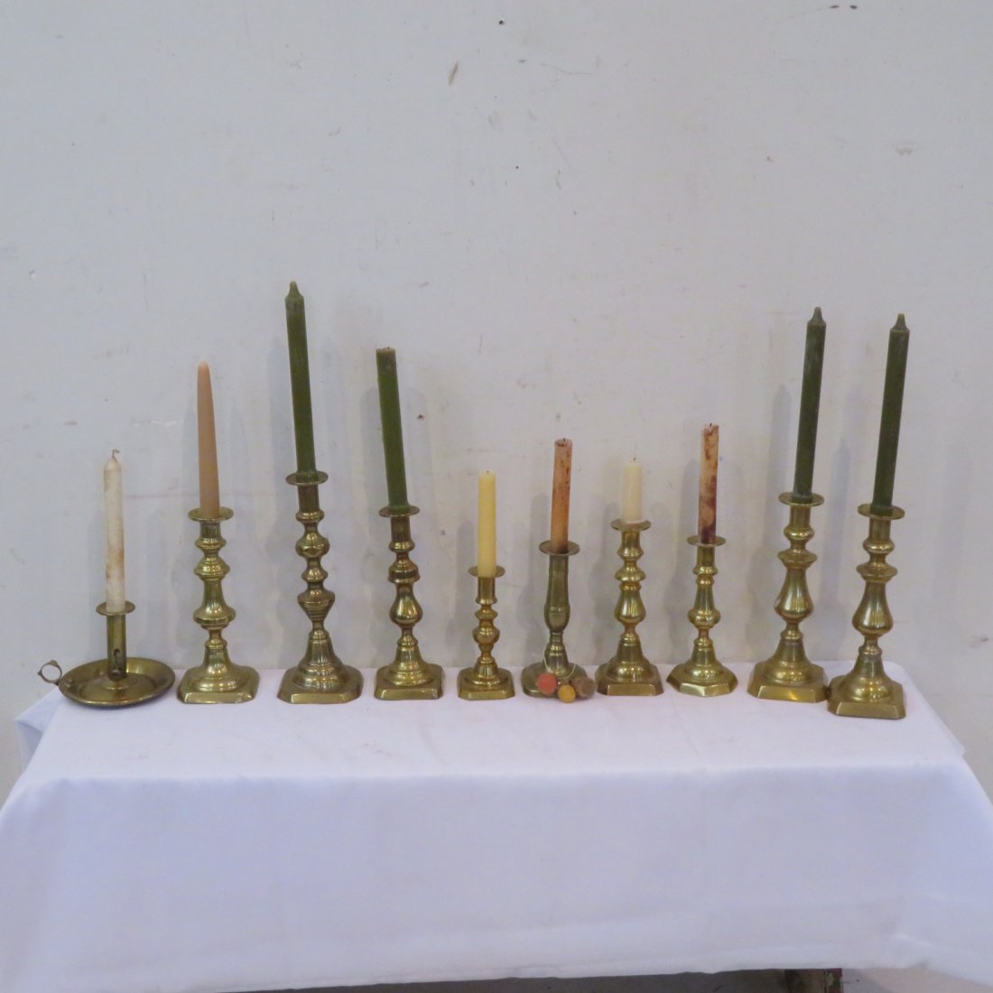 9 period brass candlesticks many with push-ups (1 of 5)