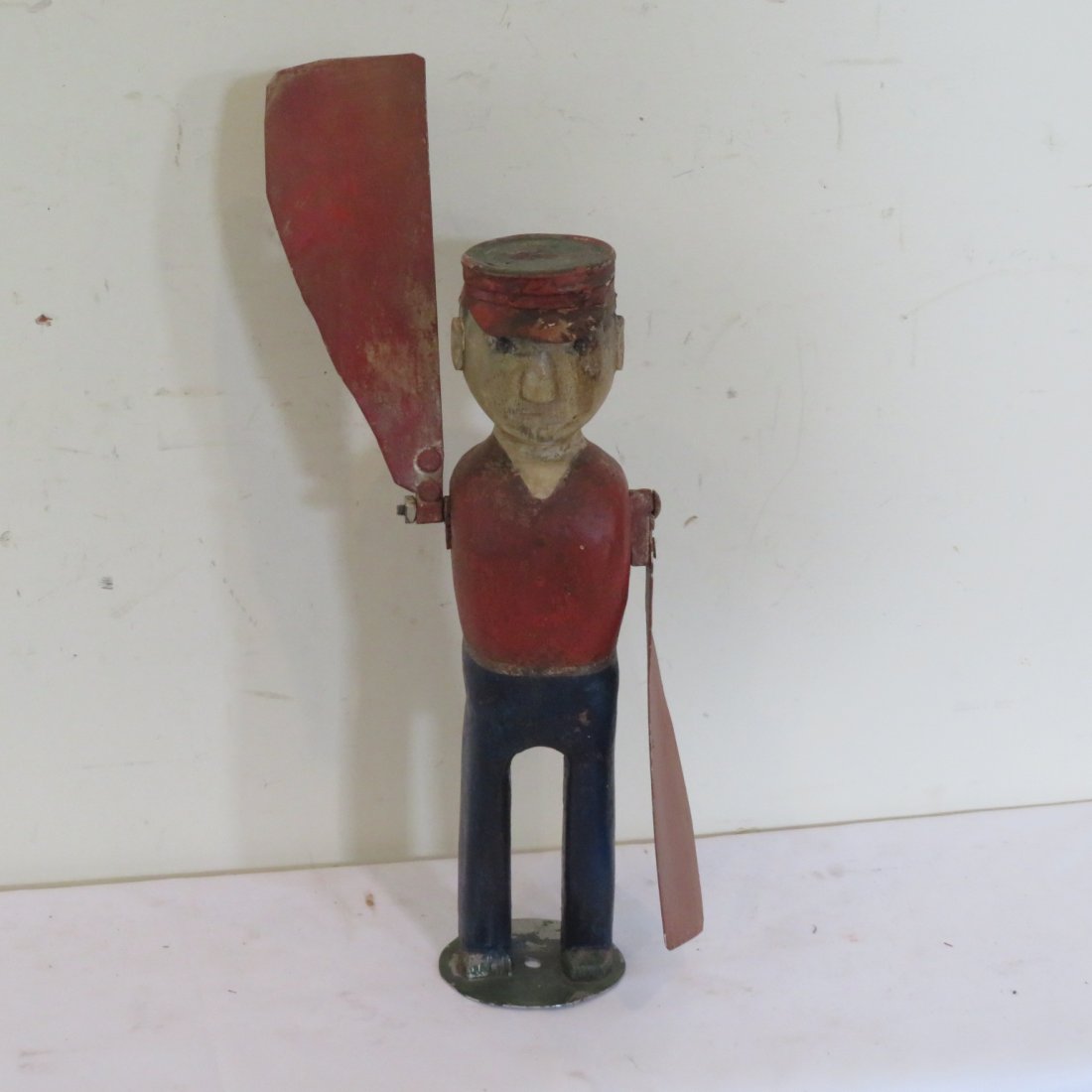 Early 20th century folk art whirligig of man: Early 20th century folk art wooden whirligig of man with tin arms and tin hat, 15"H to top of head