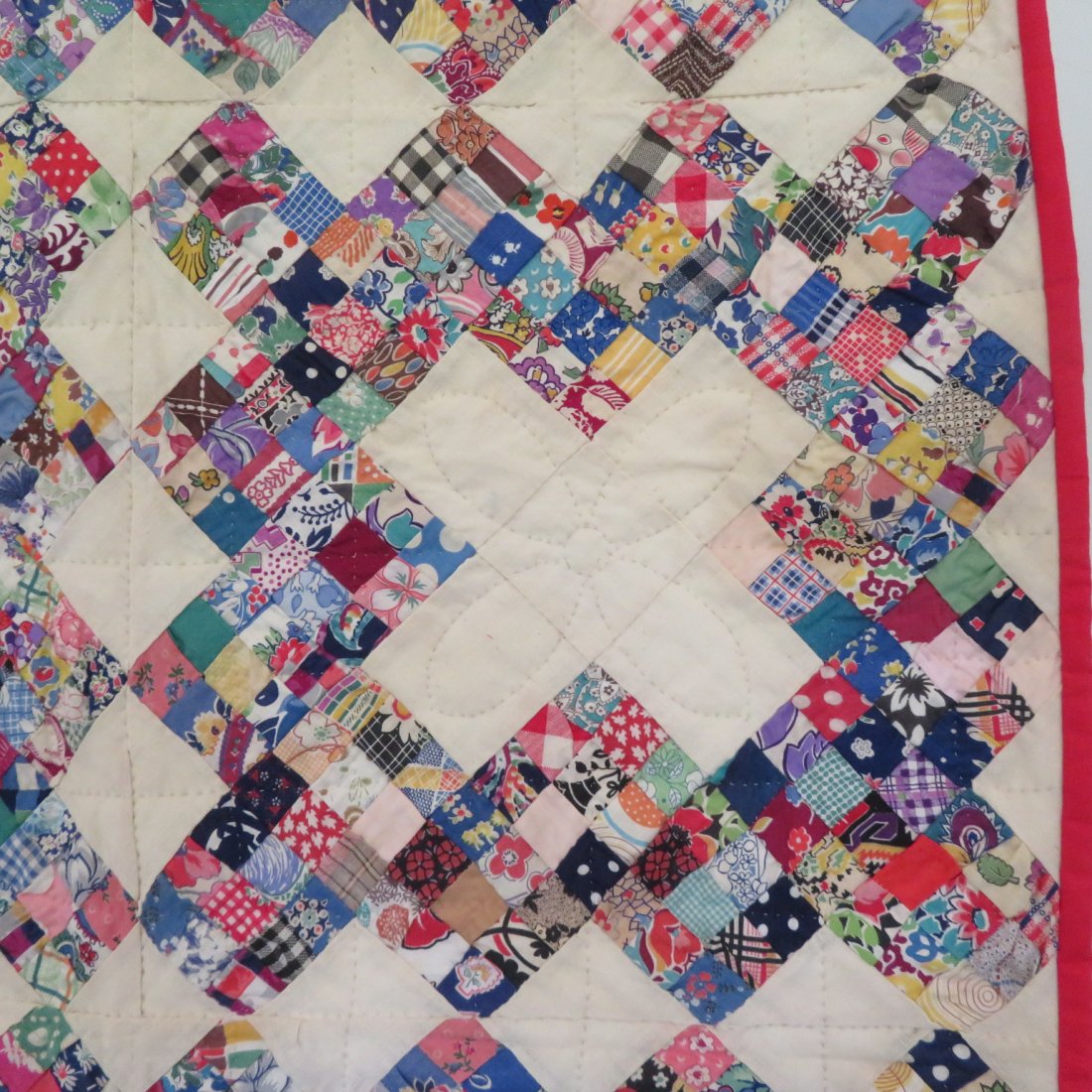 Twin size hand stitched patchwork quilt with red border (1 of 3)