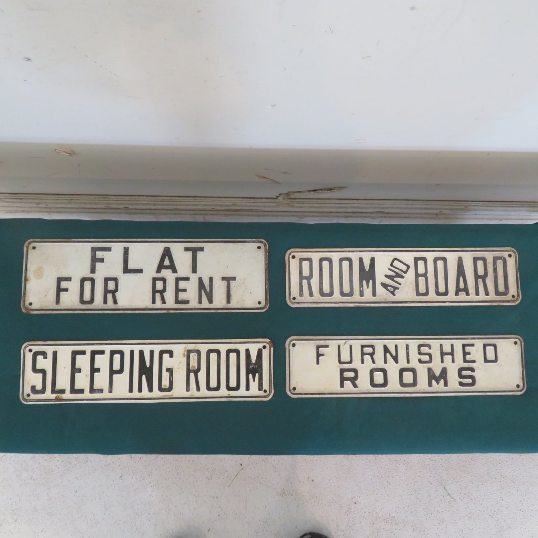 4 embossed tin signs (1 of 2)