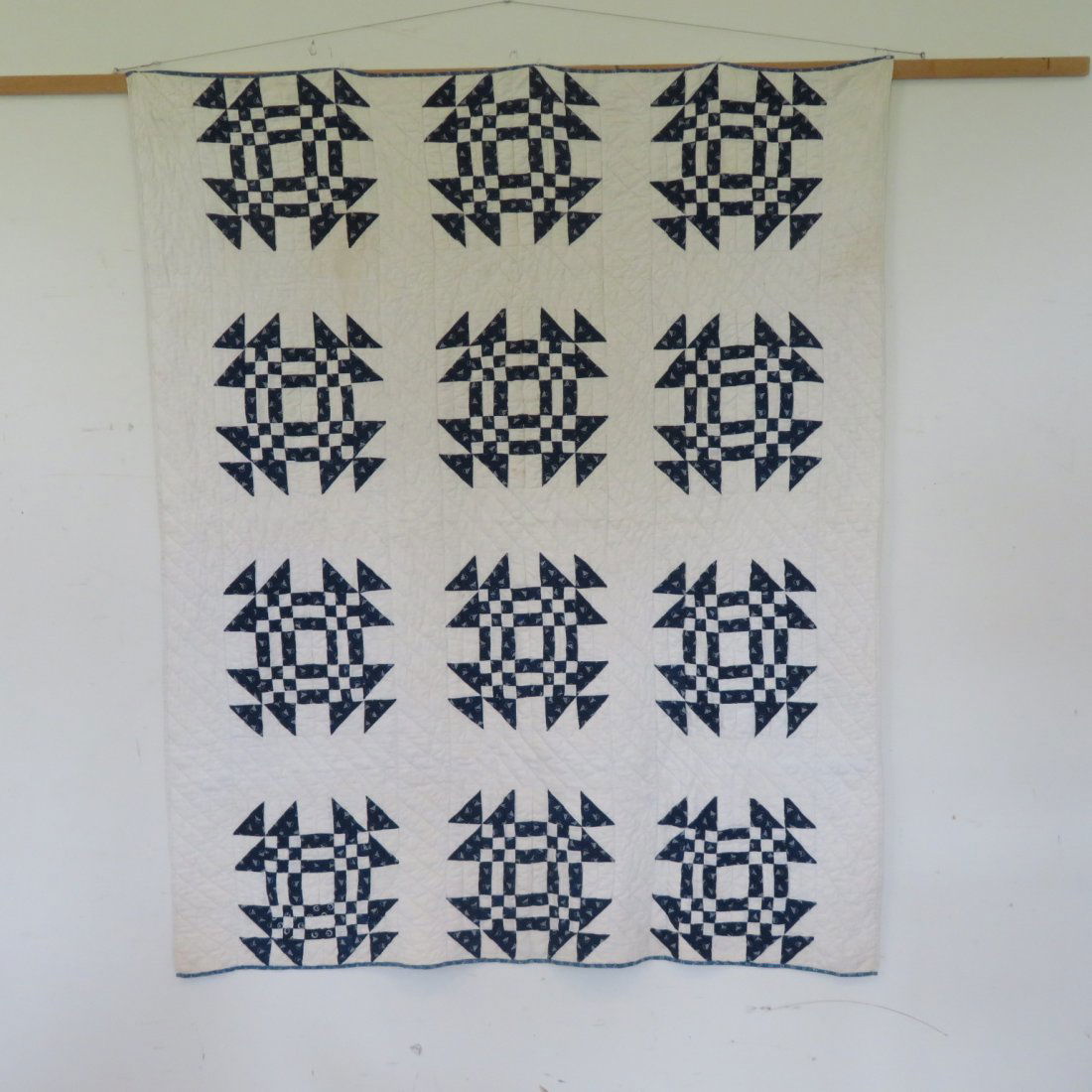 Patchwork blue and white quilt in monkey wrench pattern (1 of 4)