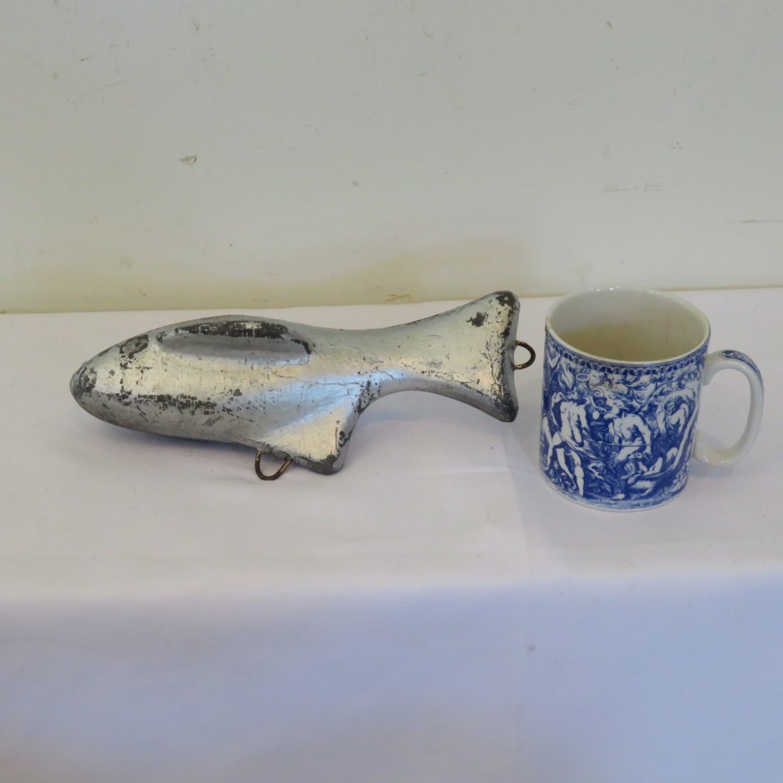 Cast iron fish weight: Cast iron fish weight, worn silver paint, 9 1/2" long, x 3 1/2"