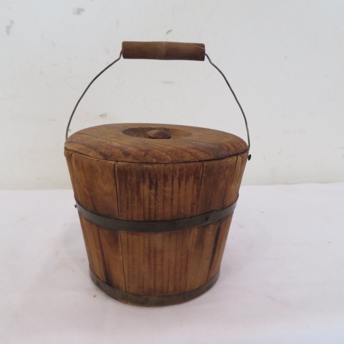 Small wood pail with lid inscribed on bottom: Small wood pail with lid, wire bale, and wood handle, inscribed on bottom: Mary Ella Parmalee Wilson born Aug. 28, 1849, old natural wood patina, 3.5"T x 4.75"D at top