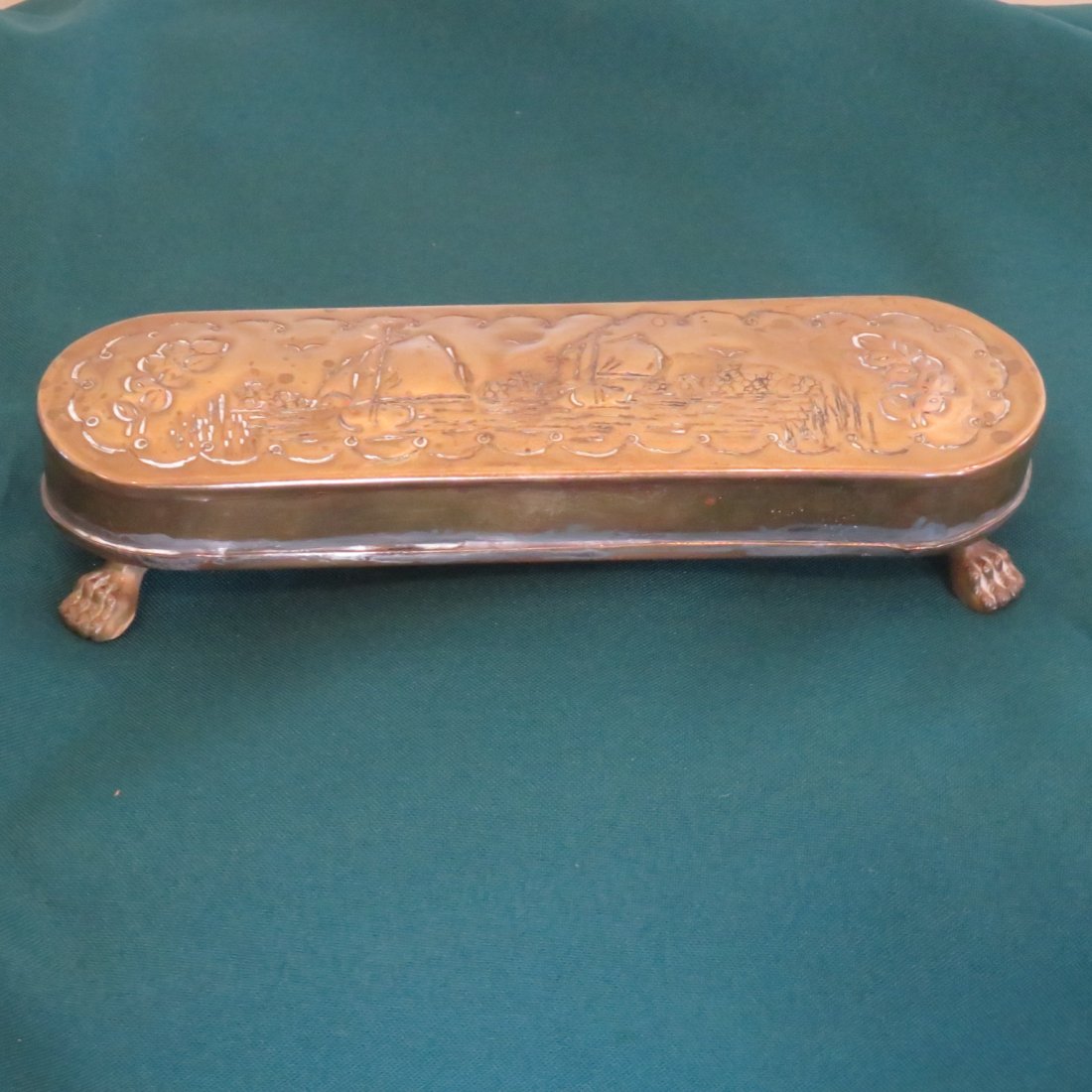 Early brass snuff box with paw feet (1 of 6)