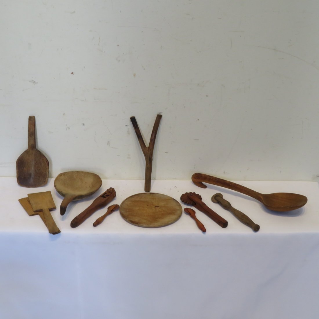 12 pcs of woodenware: 12 pcs of woodenware including 5 pie crimpers, butter paddles, wooden spoon, small cutting board, slingshot, and others, large spoon is 13.5"L and smallest crimper is 4.5"L
