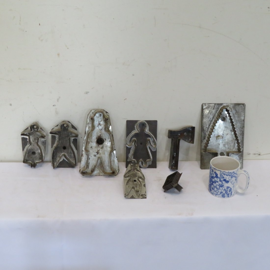 Group of 8 cookie cutters: Group of 8 cookie cutters includes: people, Christmas tree, hatchet, and tulip, pine tree is 7.5"H x 5"W