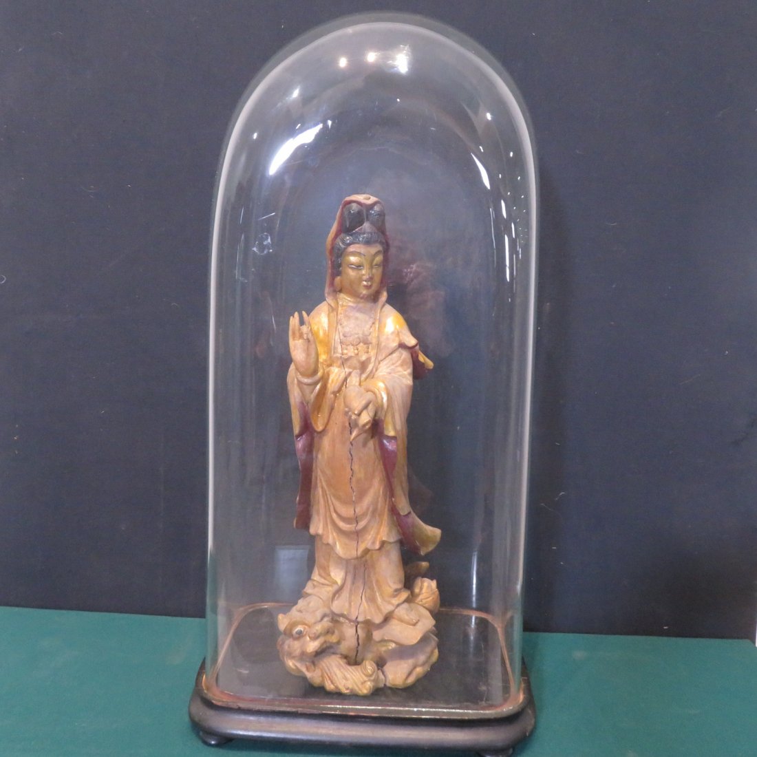 Wood oriental figure in glass dome (1 of 5)