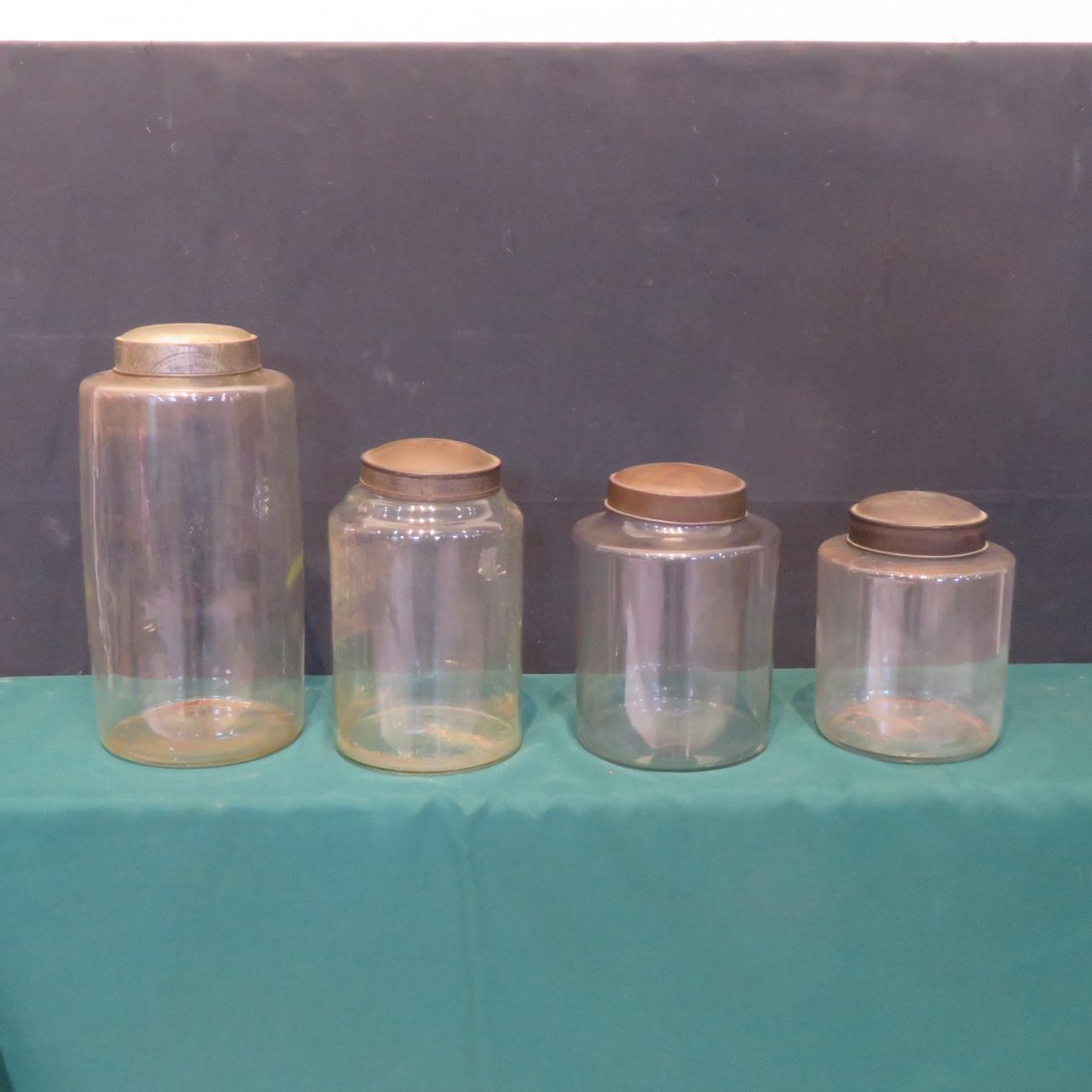 4 glass storage jars with tin lids (1 of 3)