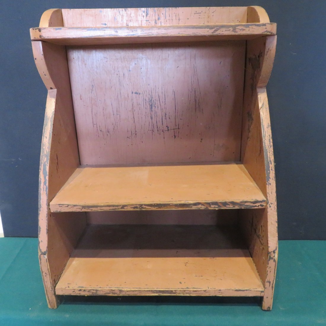 Painted wooden shelf in salmon paint (1 of 3)