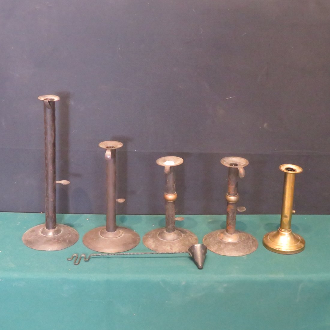 4 - 20th century hogscraper and 1 brass candlestick: 4 - 20th century hogscrapers and 1 older brass candlestick, includes a pair of wedding ring 7.5"H, tallest candlestick is 12.5"H