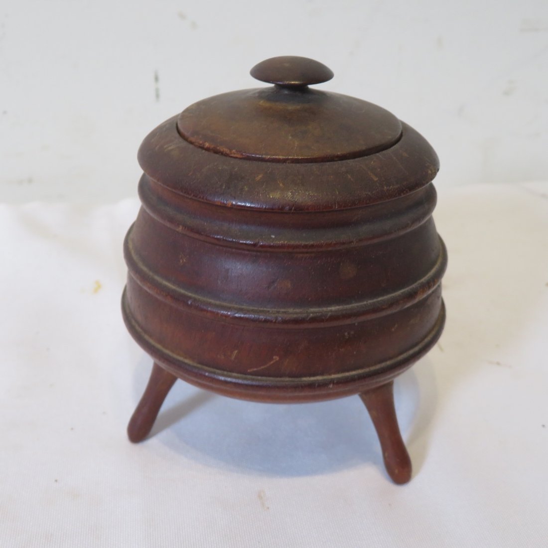 Diminutive early treenware covered footed box (1 of 5)