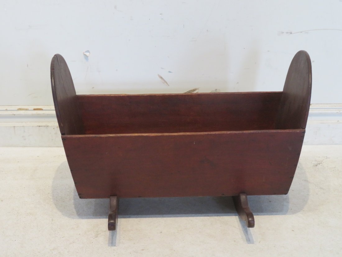 Shaker wood cradle attributed to Pleasant Hill, KY: Shaker wood cradle attributed to Pleasant Hill, KY, cherry in old original surface, rockers have mortis and tenon construction, cradle is square nailed construction, 21"H x 31.5"L x 13.5"W. Ex. Late M
