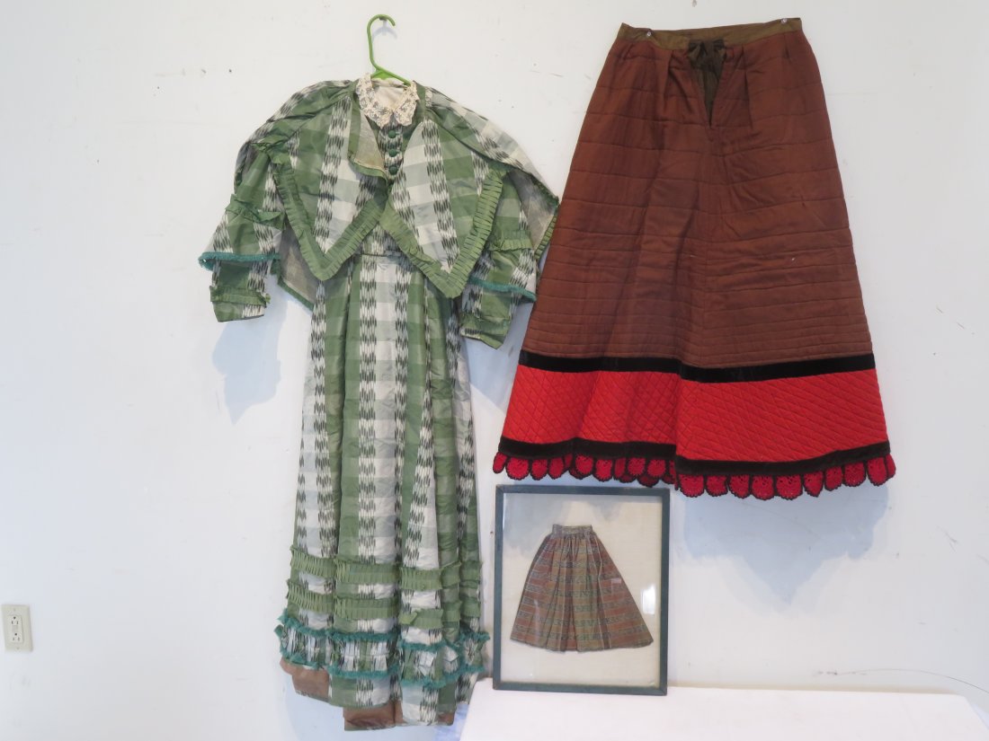 3 pcs of 19th century clothing: 3 pcs of 19th century clothing including: one 2-pc dress with cape, has a lace collar and is 54"L, one quilted petticoat 37"L, and one framed doll skirt