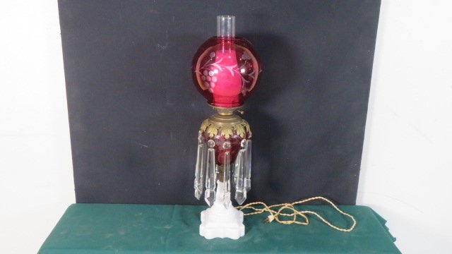 Cranberry etched kerosene lamp with milk glass base: Cranberry etched kerosene lamp with milk glass base with long crystal prisms, cranberry etched shade (electrified), overall 25"T x shade is 8"W
