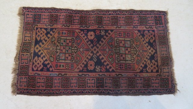 Early 20th century oriental throw rug (1 of 2)