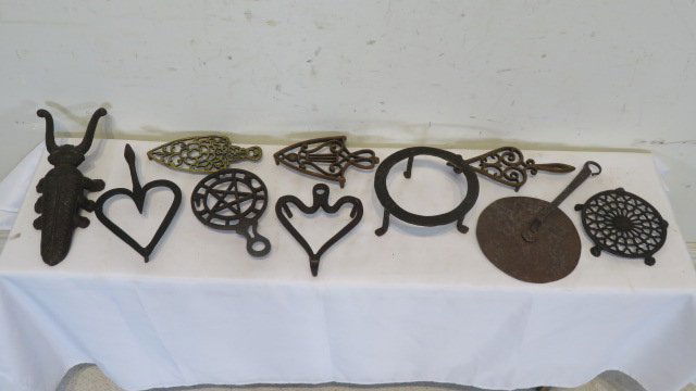 8 iron & brass trivets, early pot lid, boot jack (1 of 4)