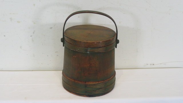 Wood firkin with lid and wood handle and traces of old green paint: Wood firkin with lid and wood handle and traces of old green paint, bands are put together with copper tacks and a staple at the ends, 9.5"T x 8.5"D (at top), 9.25"D (at bottom)