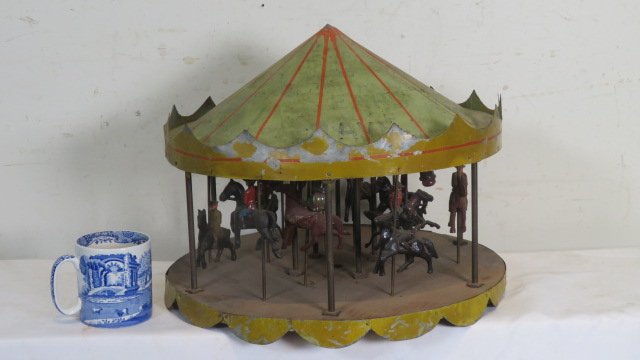 Folk art tin, wood, and iron  carousel (1 of 4)