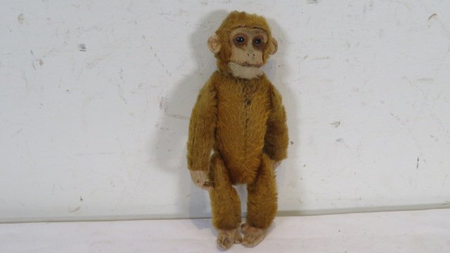 Mohair monkey with glass whiskey flask: Mohair monkey with glass whiskey flask, glass eyes, 8"T. Provenance the late Sally Siegrist