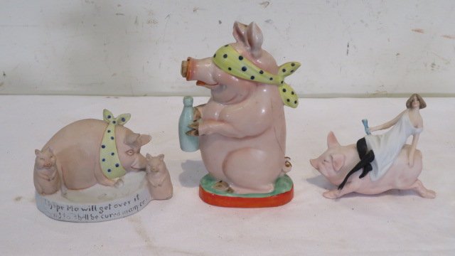 3 Bisque pigs: 3 Bisque pigs including pig toothpick holder, pig flask 5.5"T, and lady lounging on a pig. Provenance the late Sally Siegrist